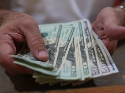 El tipo de cambio para solventar obligaciones denominadas en moneda extranjera en el país es de 18.6196 pesos. EL INFORMADOR/ARCHIVO
