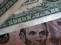 De acuerdo al Banco de México el tipo de cambio fue de 18.4004 pesos. AFP / ARCHIVO