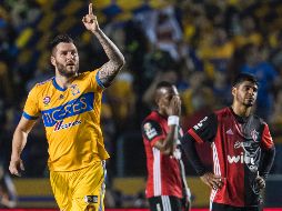 Gignac celebra uno de los dos goles que metió ante Atlas. MEXSPORT/J. Martínez