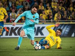 Messi anota para los catalanes al minuto 21, pero los locales igualan con gol de Calleri al 48'. AFP/D. Martin