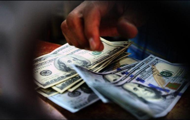 Banco BASE estima que el tipo de cambio se cotiza entre 18.66 y 18.90 pesos . EL INFORMADOR / ARCHIVO