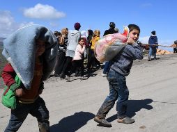 El Observatorio Sirio de Derechos Humanos elevó a 200 mil los civiles que han abandonado sus hogares en los últimos tres días. AFP/G. Ourfalian