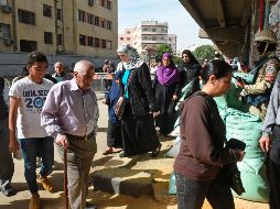 Desde temprana hora, en varios centros electorales se apreciaban largas filas de electores. AFP/K. Desouki