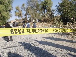 Elementos de la Fiscalía del estado realizaron el levantamiento de evidencias, de los cuerpos e iniciaron la investigación. EL INFORMADOR/ ARCHIVO