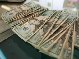 El tipo de cambio para solventar operaciones denominadas en moneda extranjera pagaderas en el país se ubica en 18.0333 pesos. EL INFORMADOR / ARCHIVO