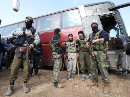 Autoridades sirias comenzaron a aplicar el acuerdo alcanzado para la salida de yihadistas del campo de refugiados de Al Yarmuk. AFP/O. Haj Kadour