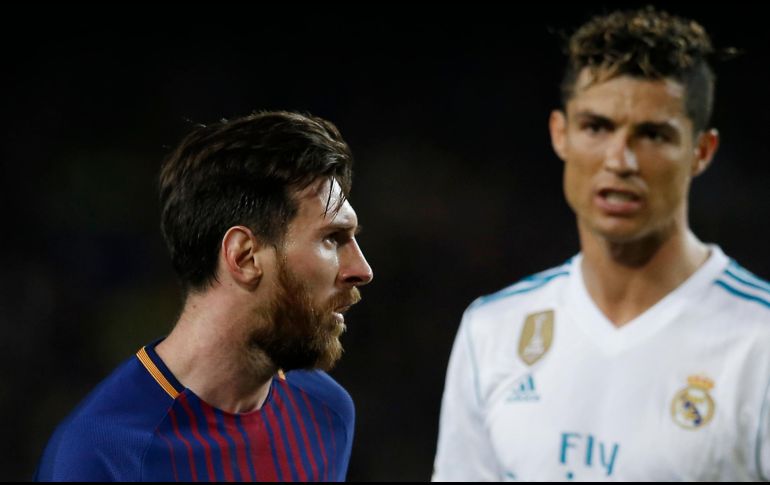 Messi (I) anotó al 53'; Cristiano (D) marcó al 14' y fue sustituido al medio tiempo. AFP/J. Lago
