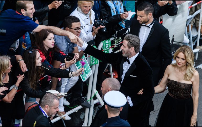 John Travolta regresó al Festival de Cine de Cannes para presentar su cinta sobre el mafioso John Gotti. EFE / C. Bilan