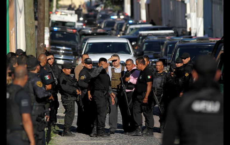 Policías se congregan en el operativo. AFP/U. Ruiz