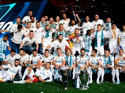 Miles de personas quisieron ver a sus ídolos con el trofeo de la Liga de Campeones bajo el brazo. AFP/O. del Pozo