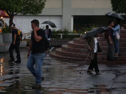 La Conagua recomienda a la población tomar precauciones al salir de casa ante la posibilidad de inundaciones y encharcamientos. EL INFORMADOR/ARCHIVO
