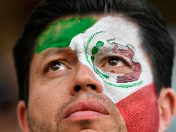 Algunos mexicanos se pintan el rostro con el verde, blanco y rojo, los colores patrios. AP / M. Meissner