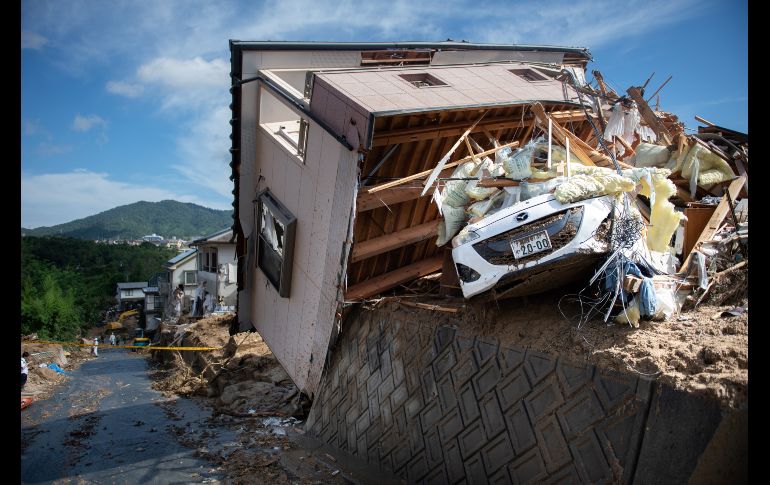 Una vivienda dañada por las inundaciones en Kumano, Japón. Rescatistas continúan con la búsqueda de desaparecidos tras lluvias torrenciales, que han provocado al menos 126 muertes. AFP/M. Bureau