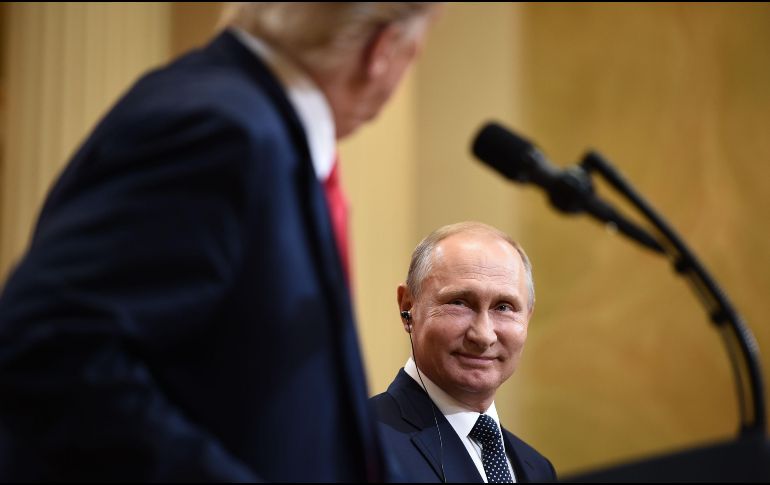 Putin tuvo palabras de elogio para su homólogo estadounidense, a quien calificó de ''interlocutor interesante'' y de ''persona muy cualificada'' que ''está en el tema''. AFP / B. Smialowski