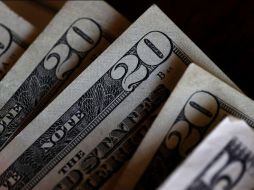 El Banco BASE prevé que el tipo de cambio cotice entre 19.00 y 19.20 pesos por dóar en cotizaciones interbancarias a la venta. AFP / ARCHIVO