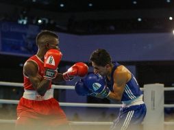 El mexicano Yoali Mejía se enfrentó al colombiano Yuberjen Martínez Rivas en la categoría minimosca. TWITTER / @Bquilla2018