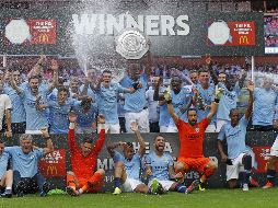 Jugadores del Manchester City celebran su triunfo. AFP / I. Kington