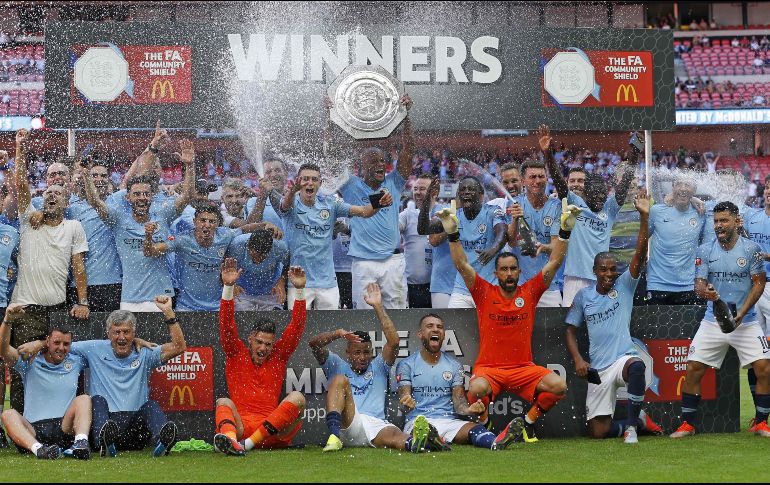 Jugadores del Manchester City celebran su triunfo. AFP / I. Kington
