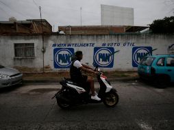 INCUMPLIMIENTO. En la calle Pitágoras, esquina con Javier Mina, todavía se observan pintas en bardas con publicidad electoral. EL INFORMADOR / F. Atilano