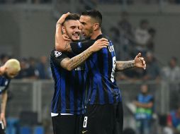 Los anotadores del conjunto italiano celebran juntos el triunfo del equipo. AFP / A. Solaro