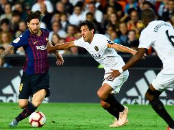 Con el Valencia en ventaja, Messi igualó el marcador con un tanto al 23'. AFP/J. Jordan