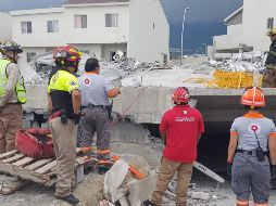 La zona del derrumbe se mantiene acordonada en tanto se llevan a cabo las labores para tratar de localizar a las personas reportadas como desaparecidas. NTX / ESPECIAL