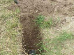 El occiso se encontraba en bolsas de plástico y la brecha tenía tierra removida de su interior. ESPECIAL/ Policía de Tlajomulco