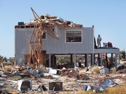 Los cuantiosos daños ocasionados por el huracán tardarán meses en ser reparados. AFP/S. Olson
