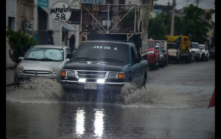 Un vehículo circula por una calle de Escuinapa. AFP/A. Estrella