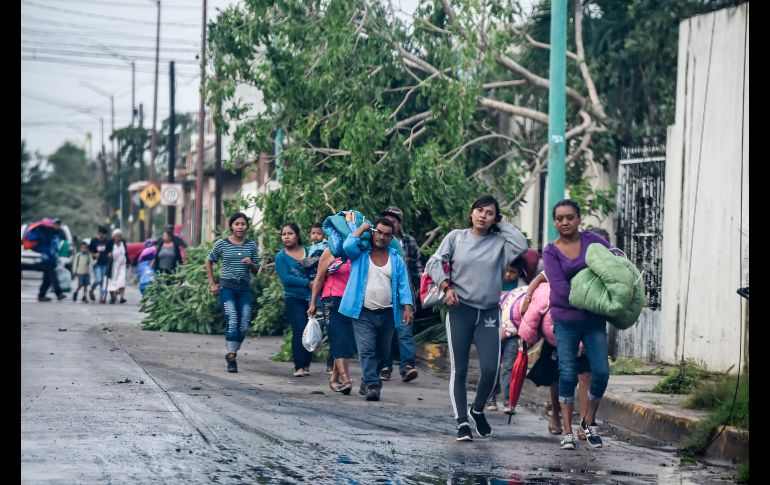Habitantes evacuados vuelven a sus hogares en Escuinapa. AFP/A. Estrella