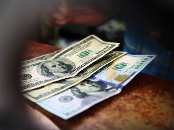 El Banxico fijó el tipo de cambio para solventar obligaciones denominadas en moneda extranjera pagaderas en 19.4790 pesos. EL INFORMADOR / ARCHIVO