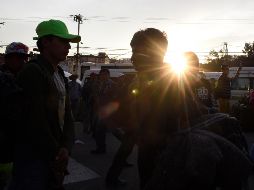 Según la Secretaría de Seguridad Pública Municipal de Querétaro, de forma ordenada, los migrantes se movilizan con el acompañamiento de autoridades hasta su salida del estado. AFP / A. Estrella
