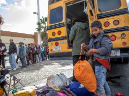Migrantes llegan a Tijuana procedentes de Sonora, a bordo de camiones que fueron custodiados durante su trayecto por patrullas de la Policía Federal. NTX/E. Jaramillo