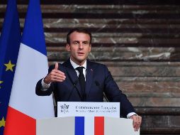 El mandatario francés reitera su promesa de otorgar subsidios para que familias de menores ingresos compren autos más limpios o medios de calefacción del hogar menos contaminantes. AFP / E. Dunand