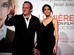 Quentin Tarantino sorprendió esta semana por su matrimonio con Daniella Pick, ambos en la imagen. AFP/J. Ksiazek