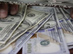 El tipo de cambio para solventar las operaciones denominadas en moneda extranjera pagaderas en el país se coloca en 19.5878 pesos. EL INFORMADOR / ARCHIVO