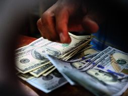 El tipo de cambio para solventar las operaciones denominadas en moneda extranjera pagaderas en el país se coloca en 19.6073 pesos. EL INFORMADOR / ARCHIVO