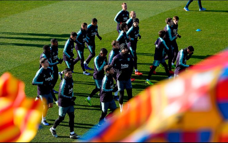 El equipo blaugrana entrenó el viernes ante su afición, en el Mini Estadio, en la capital catalana. AFP / J. Lago