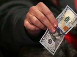 En la sesión de este día se espera que el tipo de cambio cotice en un canal entre 18.95 y 19.15 pesos por dólar. AFP / ARCHIVO