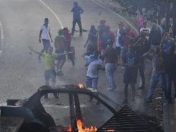Denuncian que las fuerzas del orden dispersaron a los manifestantes con gases lacrimógenos. AFP/Y. Cortez
