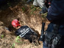 Los peritos de la Fiscalía General del Estado que fueron notificados de los hallazgos, por parte del colectivo de rastreadoras. EFE/ ARCHIVO