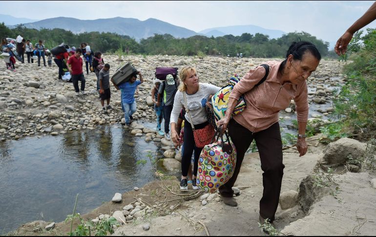 Según el informe, la mayoría de los migrantes se encuentran en Colombia, Perú, Chile, Ecuador, Argentina y Brasil. AFP / ARCHIVO