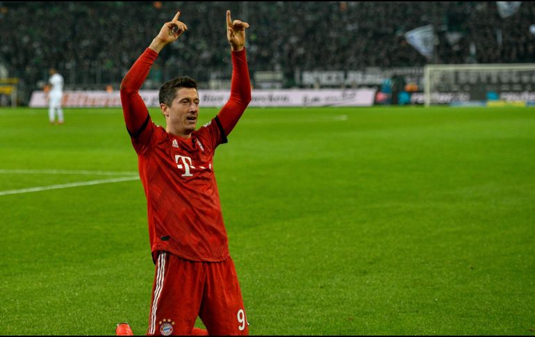 A falta de cinco minutos para el final, Robert Lewandowski selló su doblete con un certero remate de cabeza tras una linda jugada entre él y Franck Ribéry. AFP /