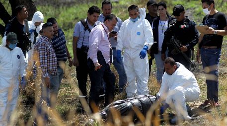 Hacia las 08:45 horas de este jueves se alertó de restos humanos dentro de bolsas al interior de un canal. AFP / U. Ruiz