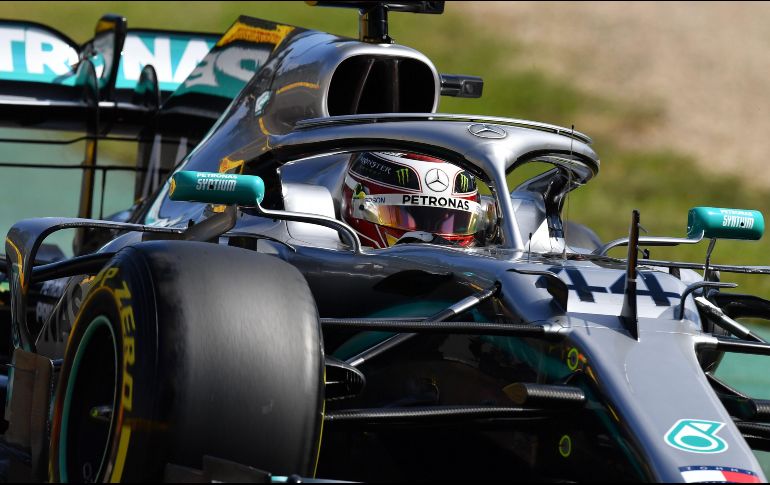 Hamilton registró una vuelta de un minuto, 23.599 segundos, 38 milésimas menos que el alemán Sebastian Vettel, de Ferrari. AFP/P. Parks