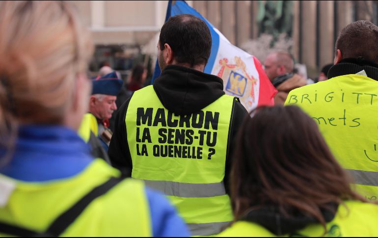 En su trayecto se escucharon consignas para exigir la renuncia del presidente Emmanuel Macron por sus políticas económicas y sociales. EFE/C. Petit