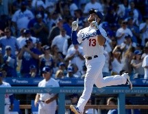 Max Muncy celebra mientras se dirige al plato durante la séptima entrada. AP/M . J. Terrill