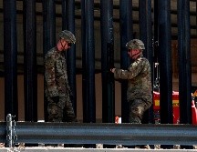 Las personas detenidas fueron llevadas en autobuses para ser sometidas a un proceso de deportación. AFP/H. Martínez