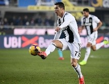 Ronaldo firmó una tripleta contra el Atlético Madrid en los octavos de final de la Champions League, para revertir un marcador adverso. AFP / ARCHIVO