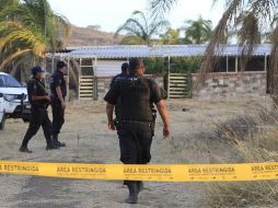 Las víctimas encontradas al interior del vehículo presentaban disparos de arma de fuego. NTX / ARCHIVO